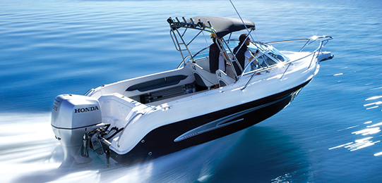 Image of three people in a speedboat